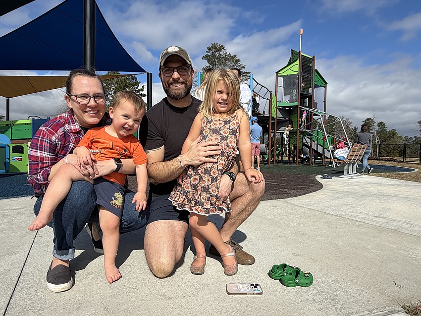 Liz Buske, 2-year-old Cooper Buske, Brett Buske and 4-year-old Caroline Buske love having the playground at Horizon West Regional Park close to home. Brett Buske is looking forward to the kayak launch opening in the future.