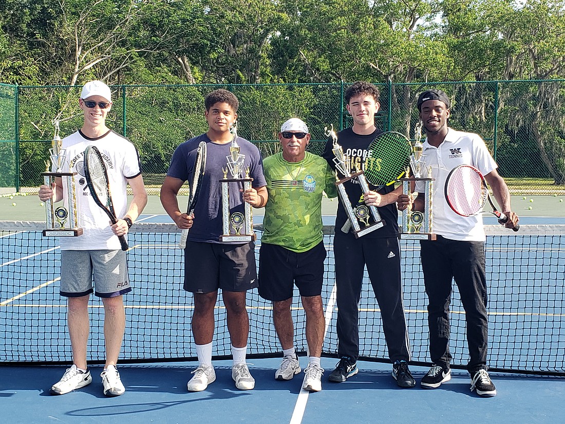 Coach Jack Vinson, middle, named David Johnson Jr., Preston Jones, Tison Waters and Jaden Lewis the 2025 Players of the Year.