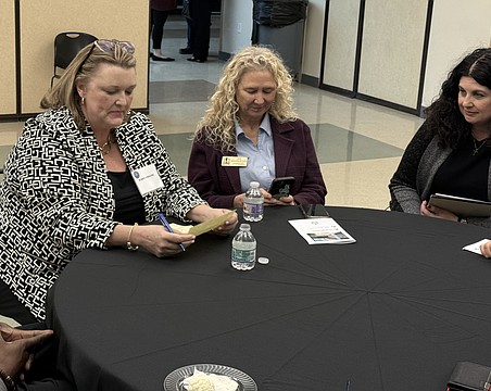 From left, Karie Friling speaks with Commissioner Jen Ahearn-Koch and Argus Foundation CEO Christine Robinson during a Feb. 23 open house event to meet the city manager finalists.