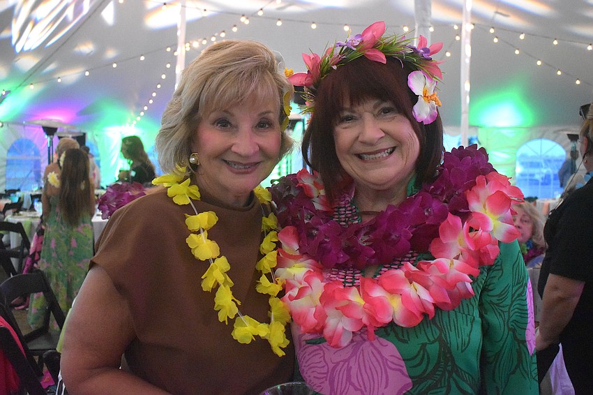 Sisterhood for Good Vice President Maria MacDonald and event sponsor Sheryl Cobb are all smiles at the Tropical Escape event.