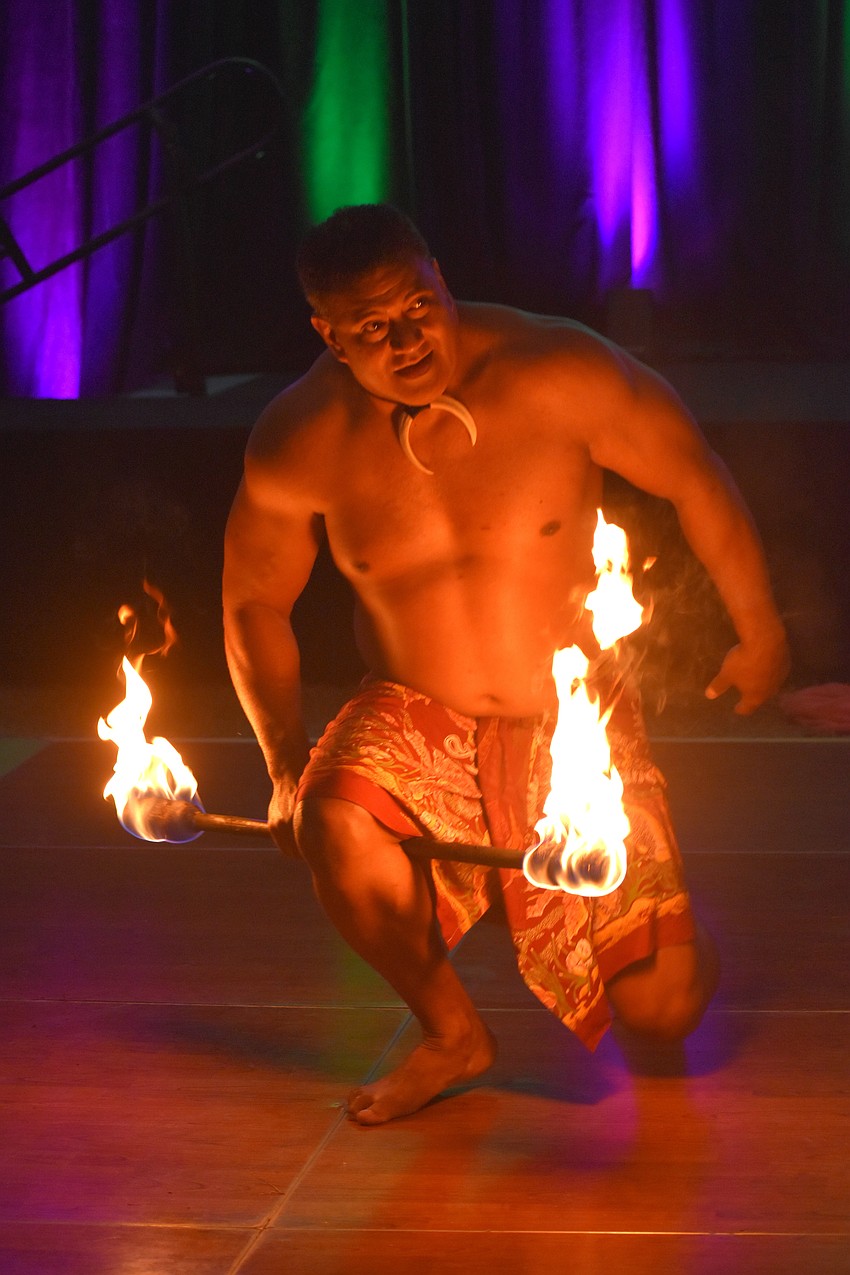 Maikeli Namudu Tuinakauvadra performs an authentic Samoan fire dance at the Sisterhood for Good Tropical Escape fundraiser Feb. 27.