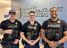 From left, SPD officers Anthony Zappone, Nick Bernier and Daniel Stevens were the first responders to a house fire on Feb. 20.