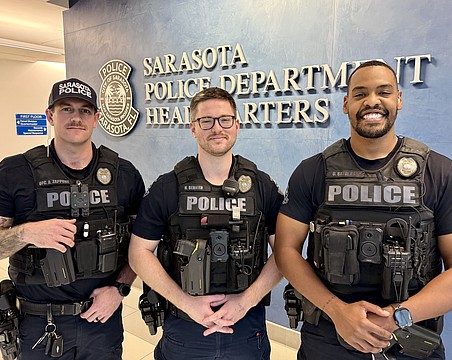 From left, SPD officers Anthony Zappone, Nick Bernier and Daniel Stevens were the first responders to a house fire on Feb. 20.