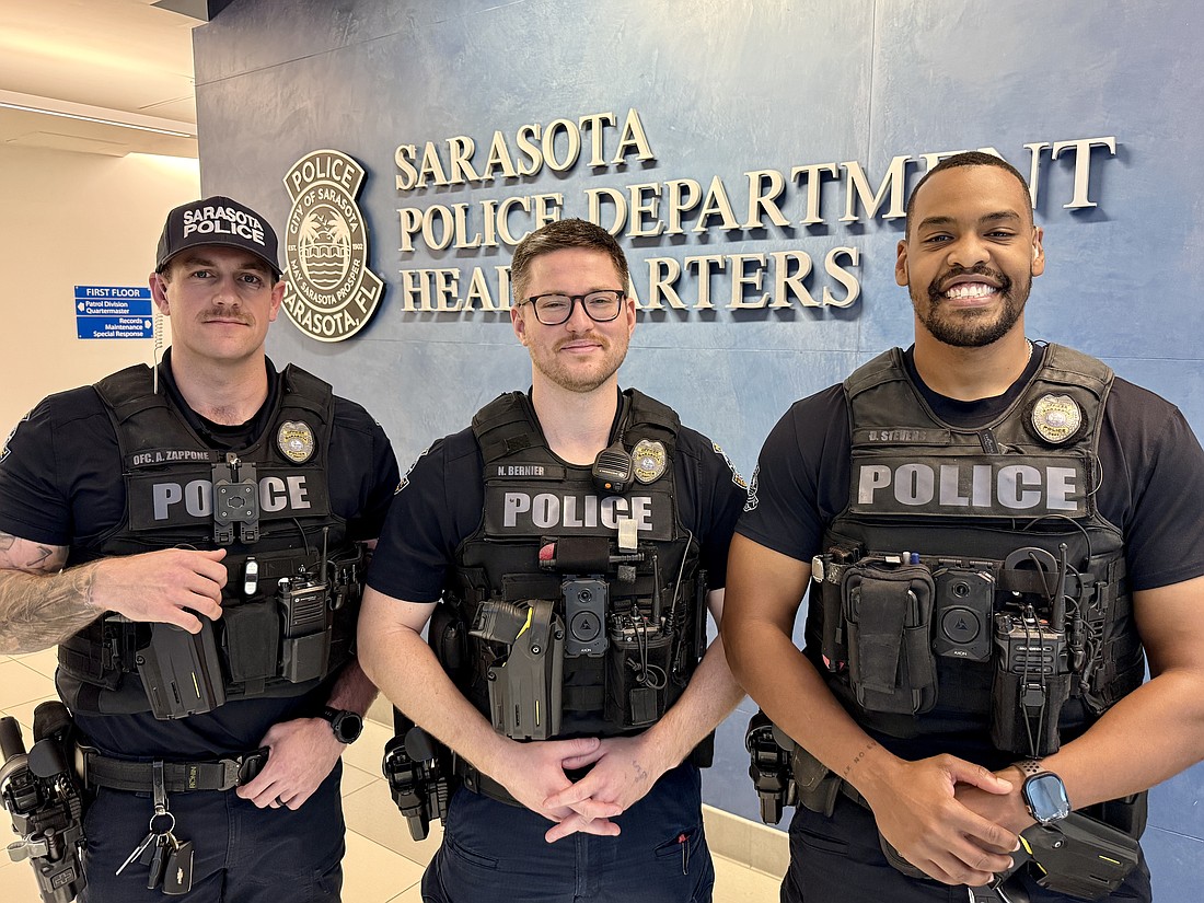 From left, SPD officers Anthony Zappone, Nick Bernier and Daniel Stevens were the first responders to a house fire on Feb. 20.