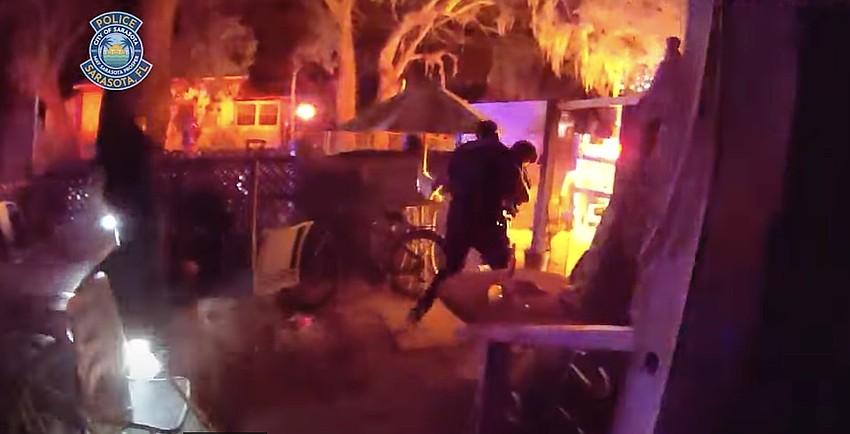 Body camera footage shows Officer Daniel Stevens carrying an elderly, mobility-challenged woman to safety during a Feb. 20 fire rescue.