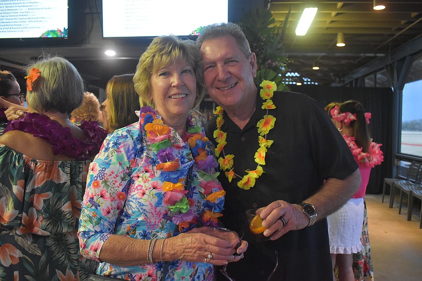 Kathy Collums, founding member and finance chair of Sisterhood for Good, enjoys the fundraiser with her husband of 45 years, Chuck.