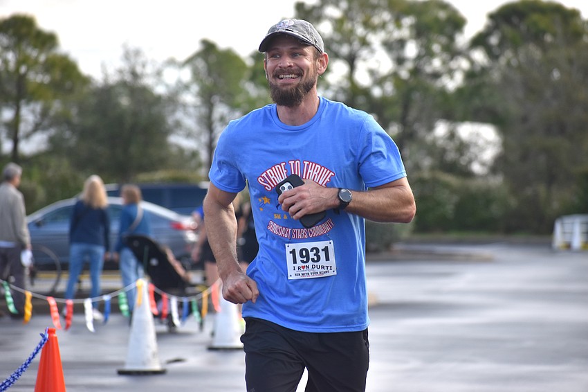 Sarasota's Matthew Buncik finishes the Stride to Thrive event. He is a sponsor of the event with Buntech Construction and also has family members who are part of the Suncoast Stars Community.
