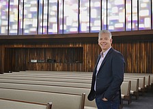 Rev. Phil Woods stands in the newly renovated 10,000-square-foot sanctuary.