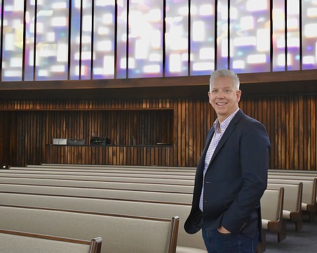 Rev. Phil Woods stands in the newly renovated 10,000-square-foot sanctuary.