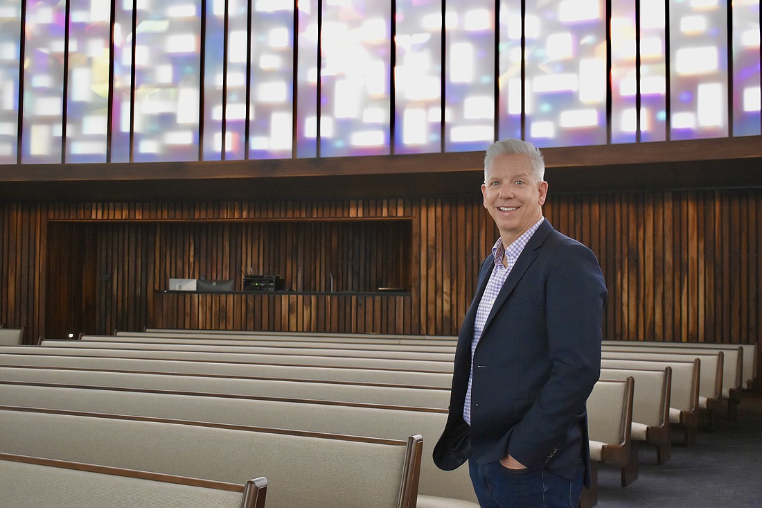 Rev. Phil Woods stands in the newly renovated 10,000-square-foot sanctuary.