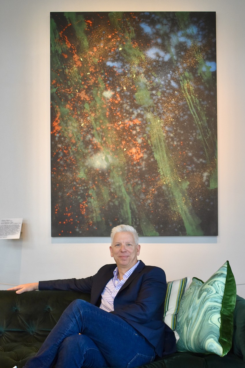 Rev. Phil Woods sits in front of 