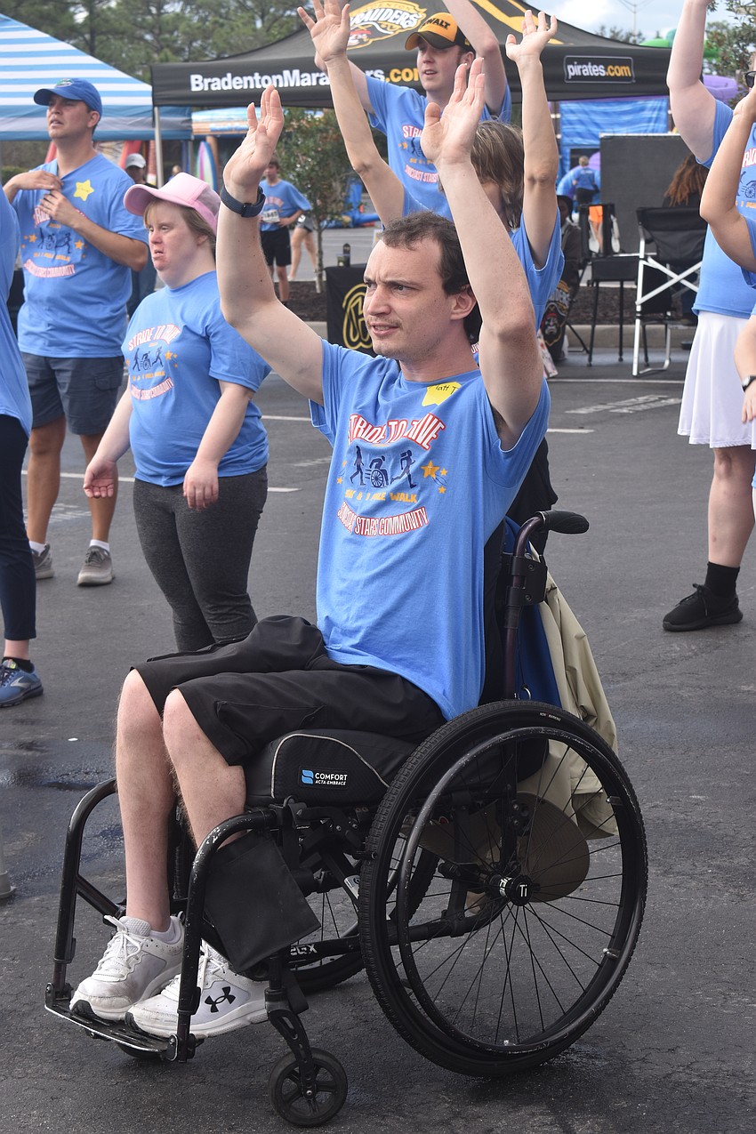 Matt Tomaino, a member of Suncoast Stars Community, performs a coordinated dance alongside his fellow dancers. He says he loves the movements and loves his friends.
