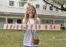 Magnolia Riner, 10, displays a design she created.