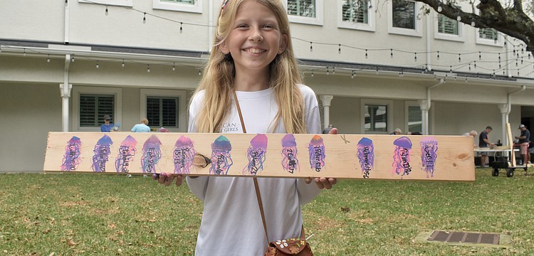 Magnolia Riner, 10, displays a design she created.