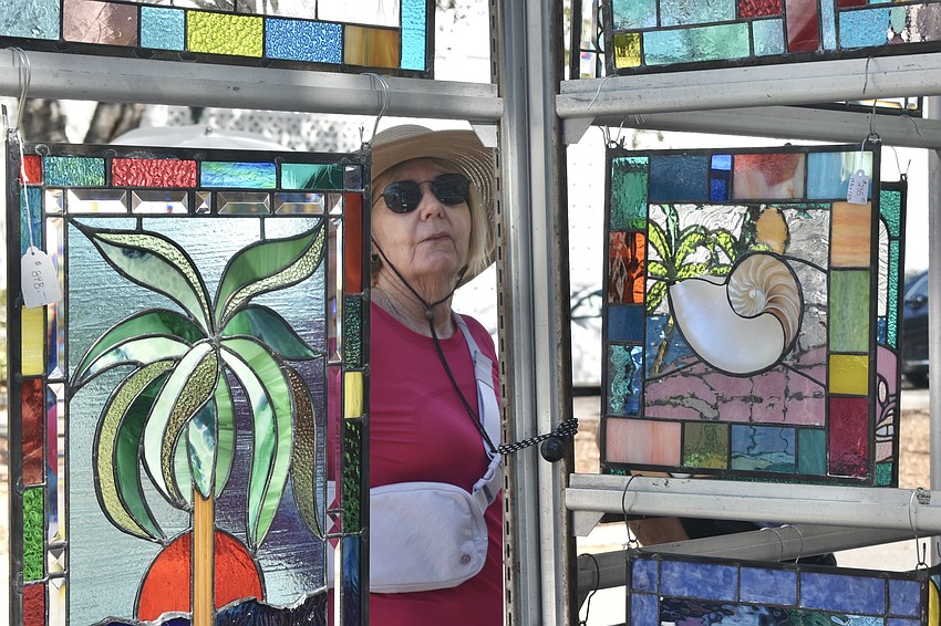 Nancy Magee checks out some stained glass artwork.