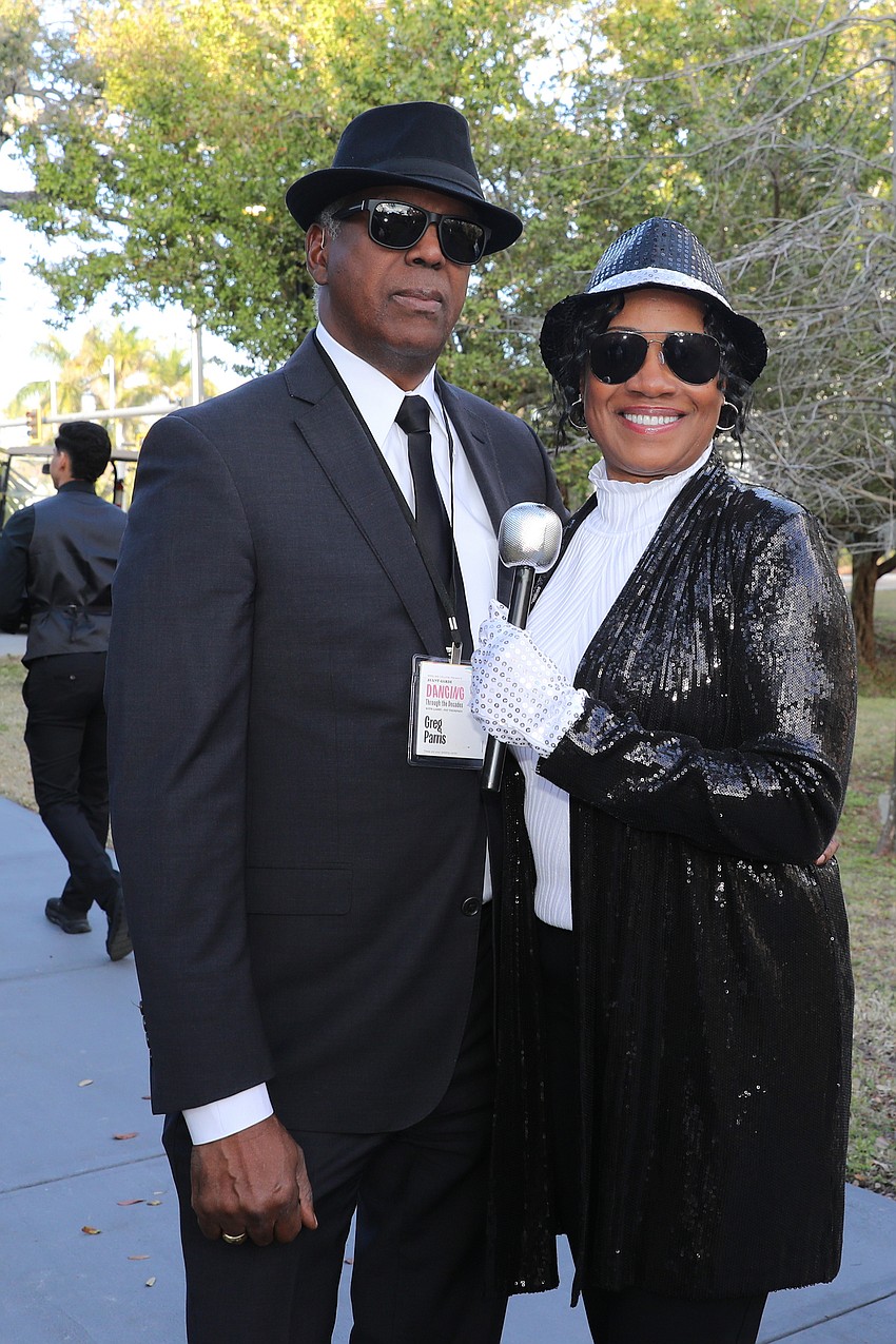 Greg and Kim Parris enjoy the Dancing Through the Decades-themed party.