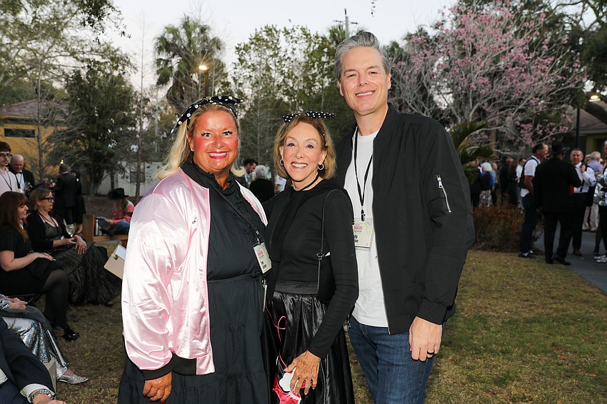 Leader of the Pink Ladies Tami Lanham and her T-Bird hubby, Phillip, and Deb Kabinoff