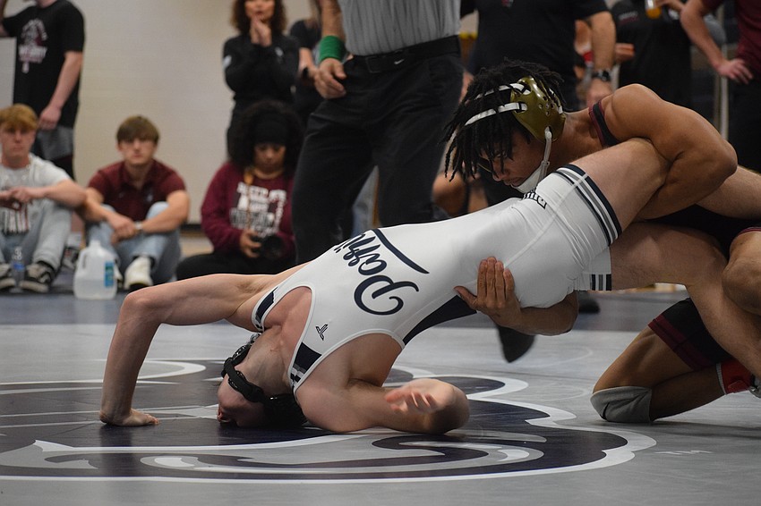 Senior Jaden Morales (right) placed in the top three for 126 pounds at both the regional and district meets. He's one of three Pirates with 50-plus victories this season. Senior Jaden Morales (right) placed in the top three for 126 pounds at both the regional and district meets. He's one of three Pirates with 50-plus victories this season.