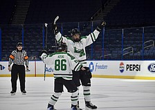 Forward Chase Koski (86) and defenseman Jackson Ellis (4) celebrate a goal Feb. 6 for Lakewood Ranch boys hockey in the Lightning High School Hockey League's title game. The Mustangs have become the premier high school-level team for skaters in the region.
