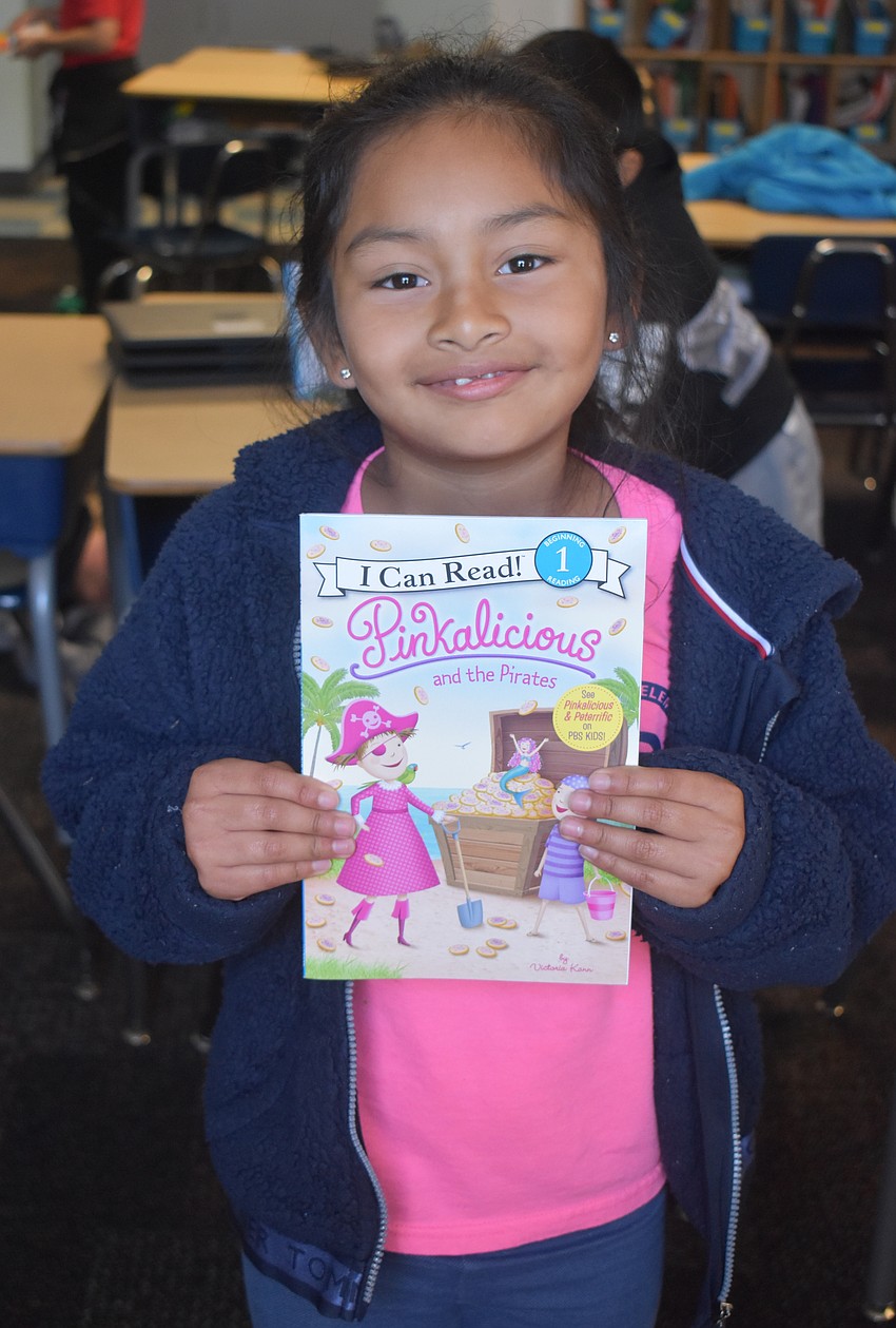 Stephanie Gomez said she likes how Gina Shulman takes her time when she reads to the class as part of the Books for Kids program.