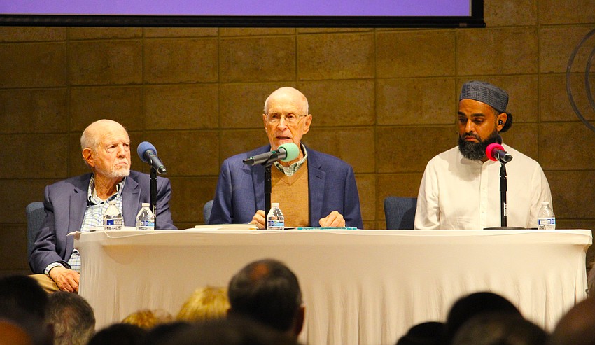 Authors Robert Gary, left, and Imam Azhar Subedar, right, speak at at panel moderated by Rabbi Peter Kasdan.