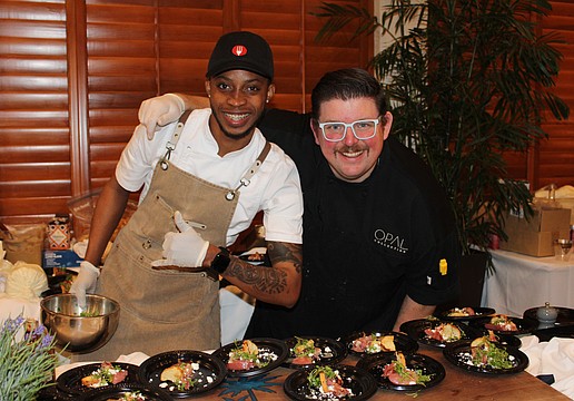 Javaughn Wallace and executive chef Michael from Drift at Lido Beach Resort dish up a poached pear and prosciutto bite at the 15th annual Taste of the Keys on Feb. 26 at the Longboat Key Club Harbourside Ballroom.