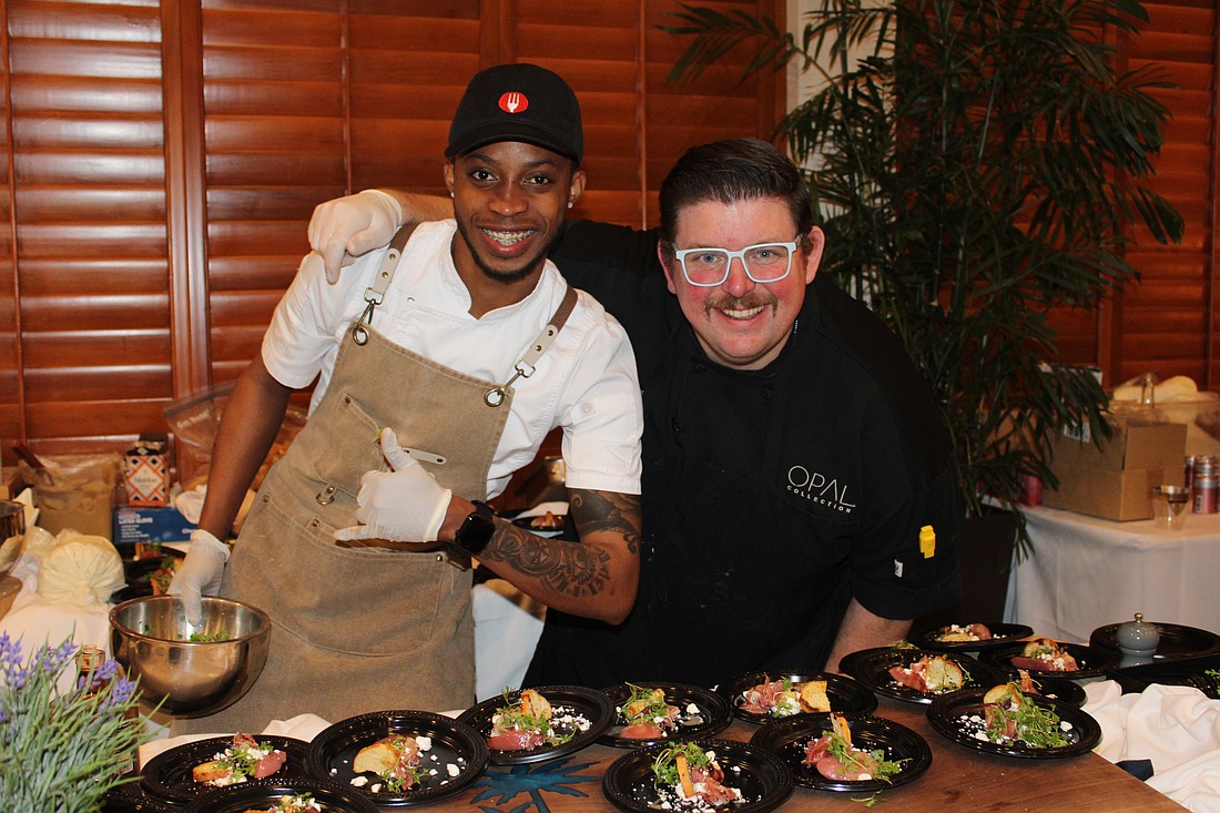Javaughn Wallace and executive chef Michael from Drift at Lido Beach Resort dish up a poached pear and prosciutto bite at the 15th annual Taste of the Keys on Feb. 26 at the Longboat Key Club Harbourside Ballroom.