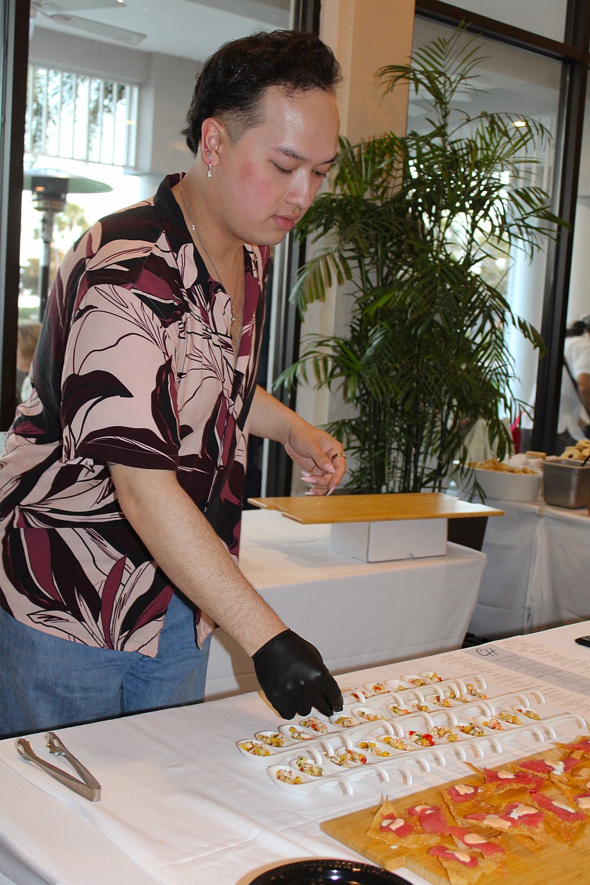 Jason Vo presents The Chart House's ahi tuna nacho and shrimp ceviche bites at the Taste of the Keys.