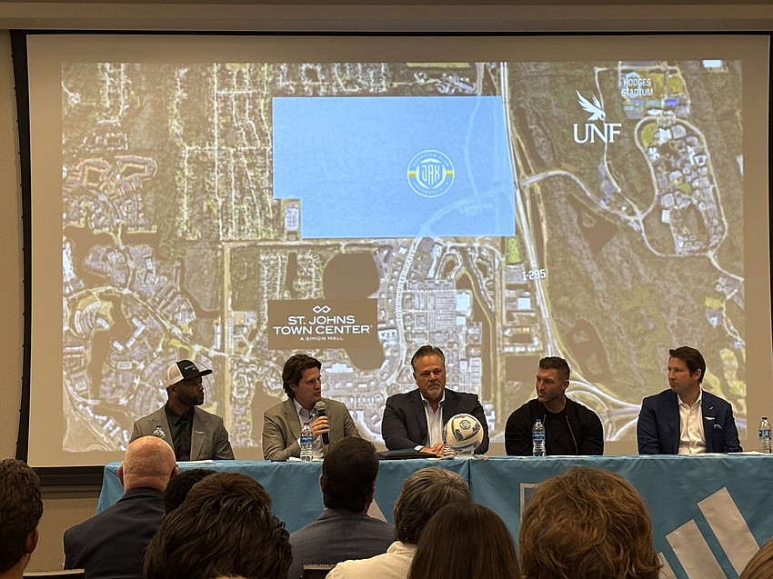 At a March 2 news conference, Sporting JAX revealed the location where it plans to build its mixed-use stadium development. From left are Fred Taylor, Justin Papadakis, Michael McNaughton, Tim Tebow and Ricky Caplin.