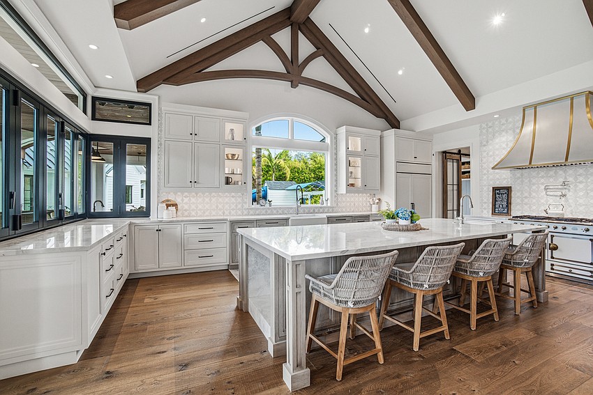 Quartzite countertops and a La Cornue gas range are among the highlights in the kitchen.