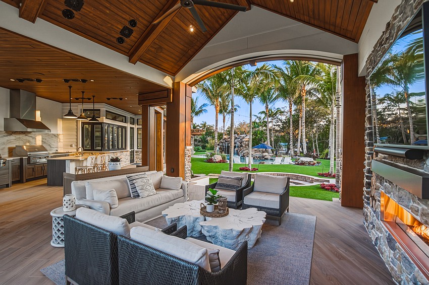 Lucas Lagoons designed the backyard, which includes an outdoor kitchen, propane firepit, putting green, integrated sound system and layered landscape lighting.