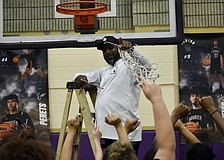 Coach Ty Bryant cuts down the net Feb. 27 after Booker girls basketball's FHSAA Class 4A-Region 3 championship. The Tornadoes have now reached the state semifinals in four of six seasons under his direction.