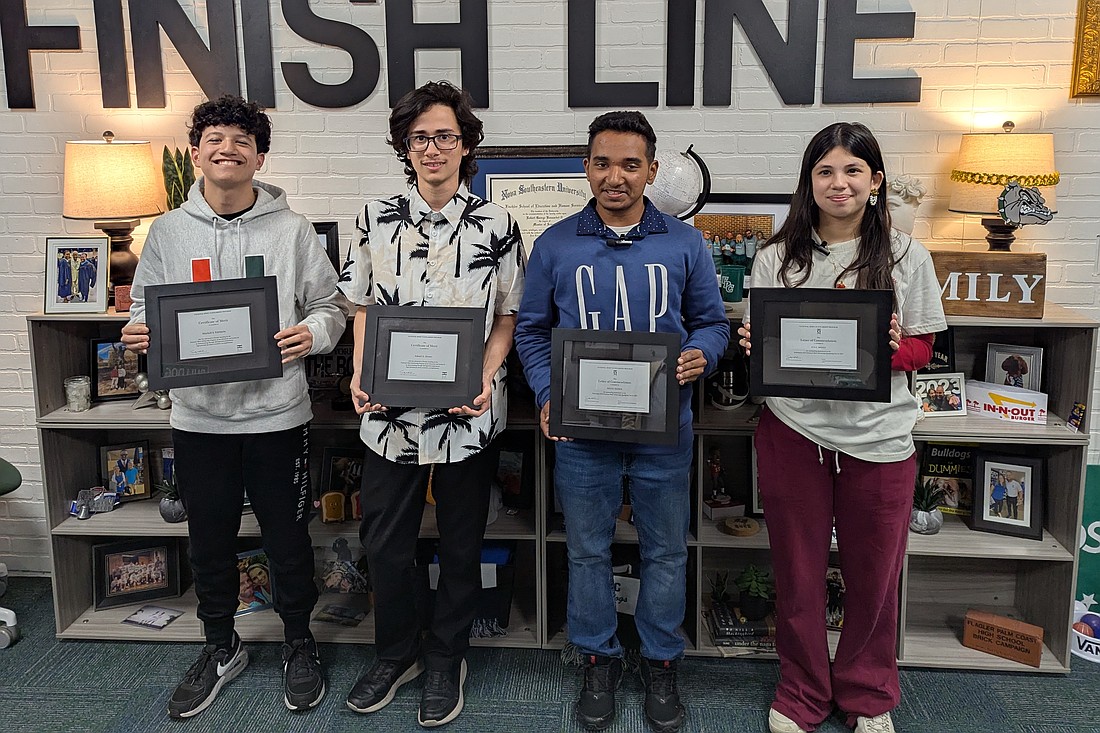 National Merit Scholarship Finalists Mitchell Spencer Edelstein and Adniel Alonso and National Merit Commended Scholars Syed Haider and Ava Mello. Photo by Brent Woronoff