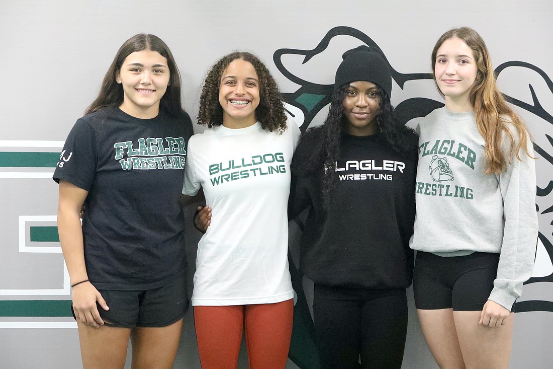 Flagler Palm Coast's qualifiers for the girls state wrestling championships: Alexa Calidonio, Juliana Mills, Joslyn Johnson and Alisha Vilar. Photo by Brent Woronoff