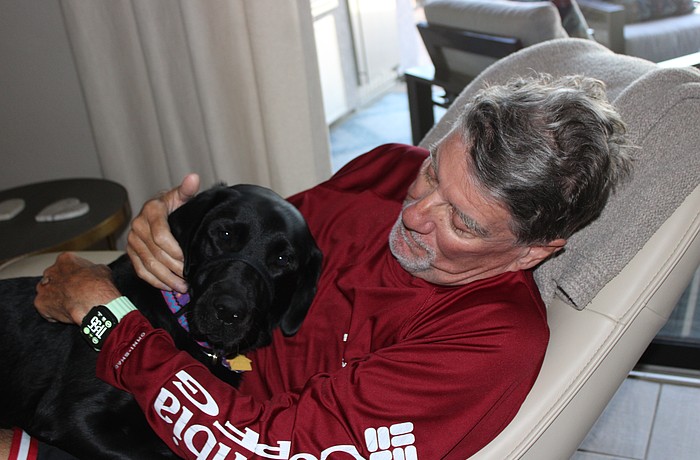 Gracie, who was trained at Dogs Inc., has returned happiness to the life of Lakewood Ranch's Mark Thornsbrough.