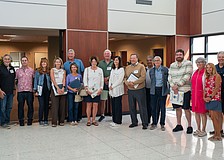 18 of the 30 Citizens Academy graduates pose for a photo at Town Hall after being recognized by town leaders at the March 2 Town Commission meeting for completing the seven-week program.