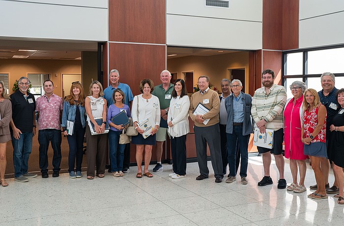 18 of the 30 Citizens Academy graduates pose for a photo at Town Hall after being recognized by town leaders at the March 2 Town Commission meeting for completing the seven-week program.