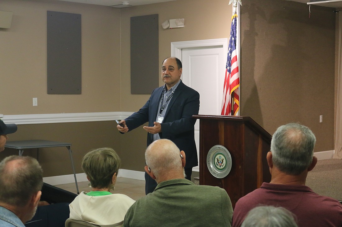 County engineer Hamid Tabassian speaks to the Hammock Community Association about local projects. Photo by Sierra Williams