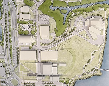 A scale model provided by Renzo Piano Building Workshop shows the positioning of the Sarasota Performing Arts Center at the bottom, flanked by two parking garages. The Van Wezel (upper right) parking lot converted into elevated park space.