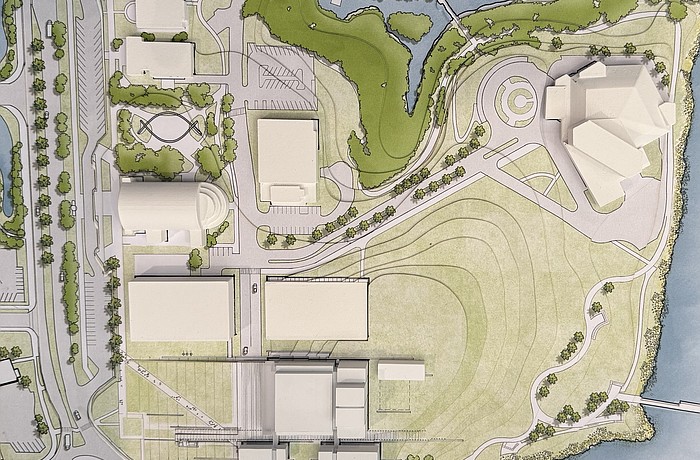 A scale model provided by Renzo Piano Building Workshop shows the positioning of the Sarasota Performing Arts Center at the bottom, flanked by two parking garages. The Van Wezel (upper right) parking lot converted into elevated park space.