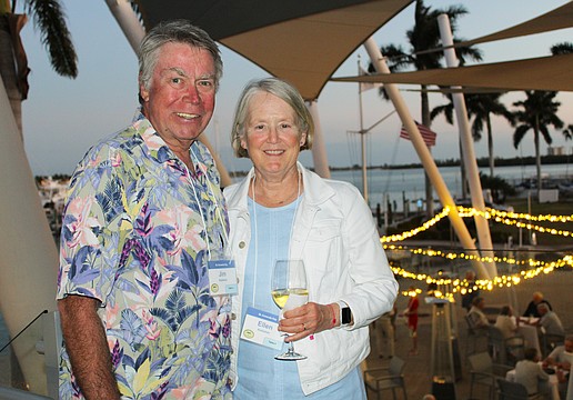 Jim and Ellen Kelleher take in the breeze from Sarasota Bay while socializing at the March 3 St. Armands Key Residents Association dinner at the Sarasota Yacht Club.