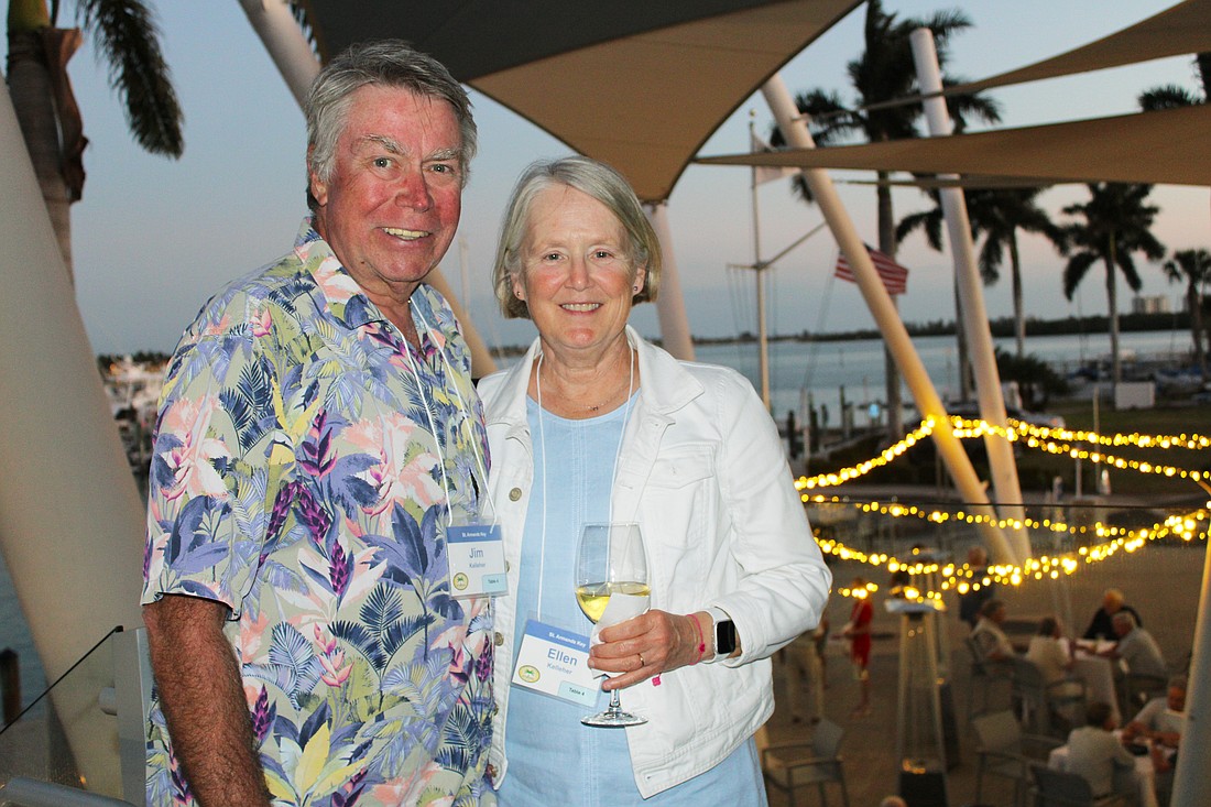 Jim and Ellen Kelleher take in the breeze from Sarasota Bay while socializing at the March 3 St. Armands Key Residents Association dinner at the Sarasota Yacht Club.