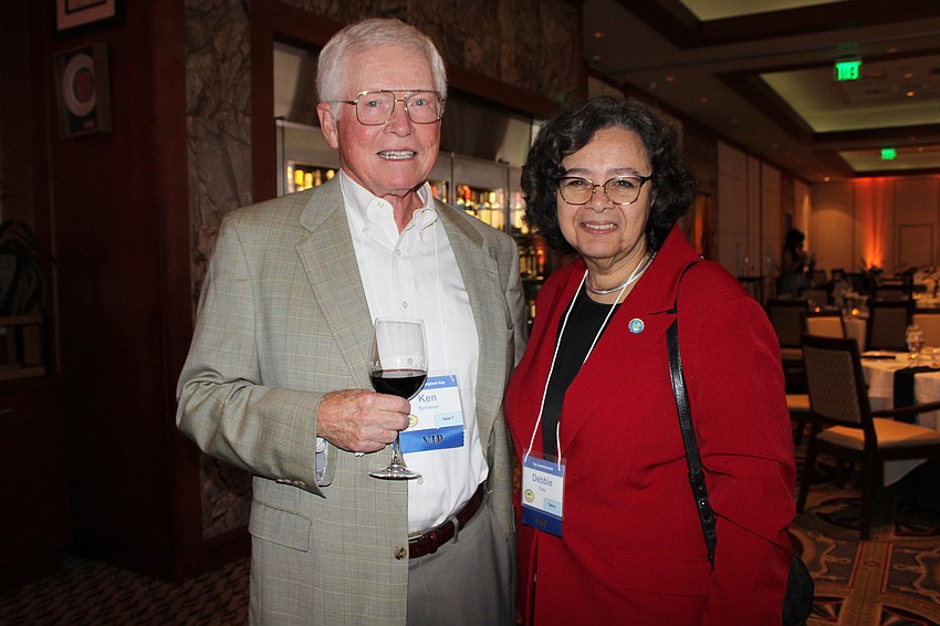 Outgoing Longboat Key Mayor Ken Schneier and City of Sarasota Mayor Debbie Trice greet one another at the St. Armands Key Residents Association annual dinner.
