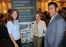Medallion Home's Kellie Reith (left) and Mark Santiago (right) chat with Judy Athari (center) of Berkshire Hathaway during the 2026 Manatee Realtor Preview event March 5 at the Grove in Lakewood Ranch.
