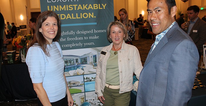 Medallion Home's Kellie Reith (left) and Mark Santiago (right) chat with Judy Athari (center) of Berkshire Hathaway during the 2026 Manatee Realtor Preview event March 5 at the Grove in Lakewood Ranch.