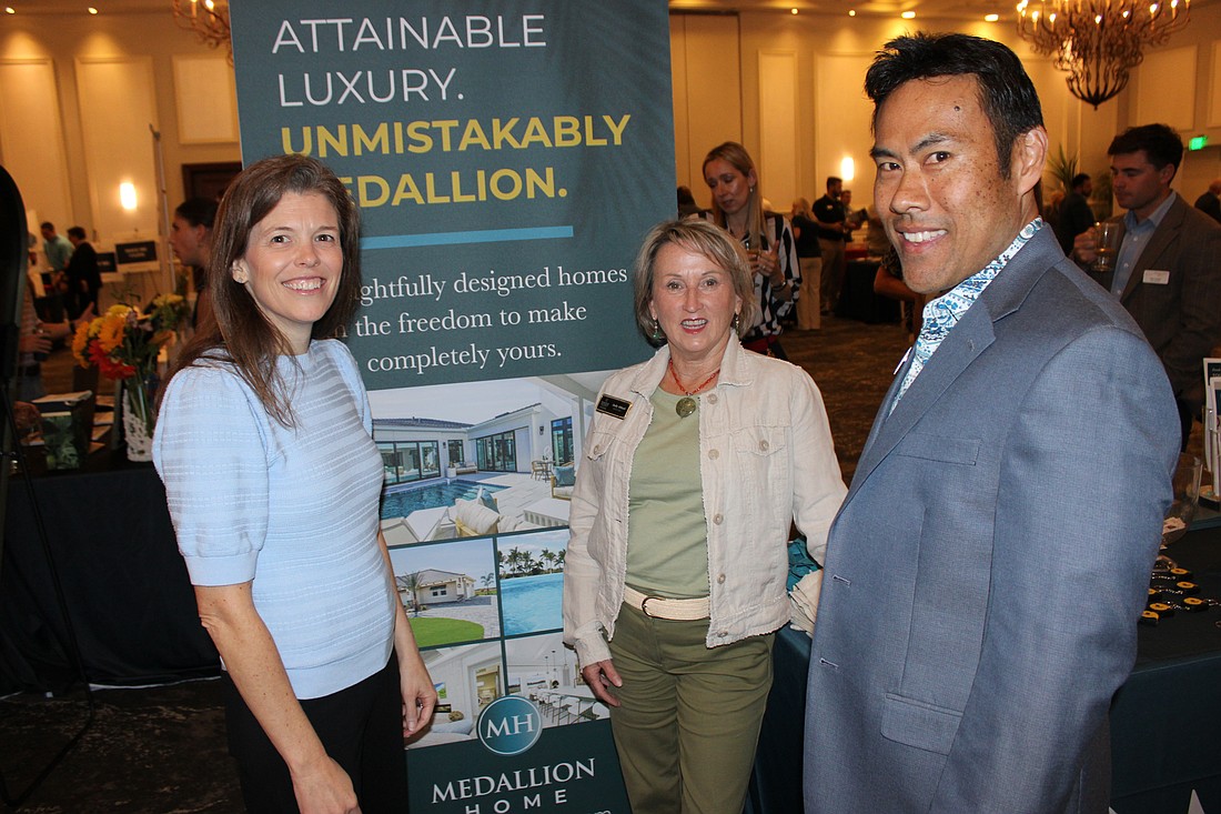 Medallion Home's Kellie Reith (left) and Mark Santiago (right) chat with Judy Athari (center) of Berkshire Hathaway during the 2026 Manatee Realtor Preview event March 5 at the Grove in Lakewood Ranch.