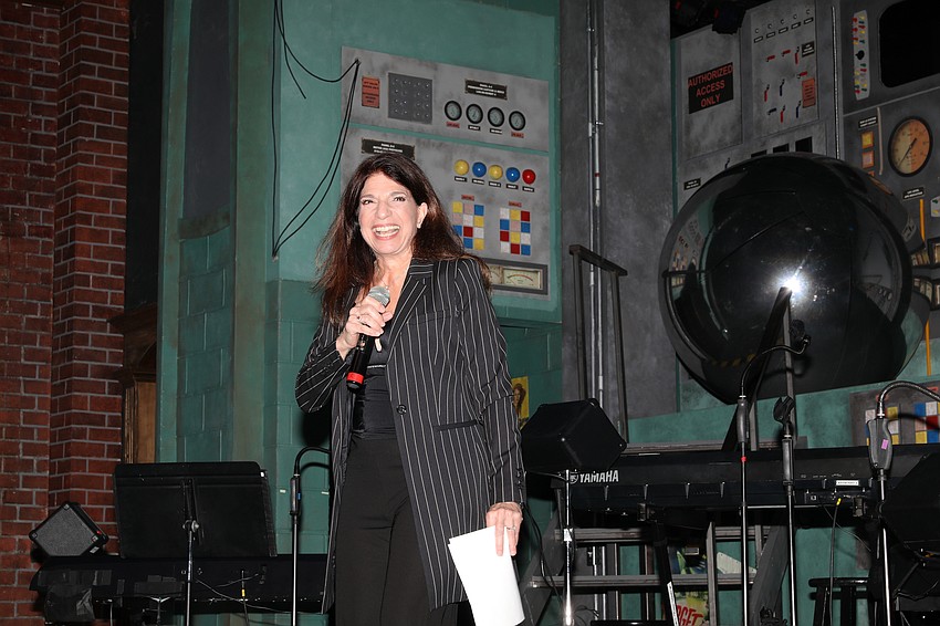 Associate Artist Catherine Randazzo led the paddle raise.