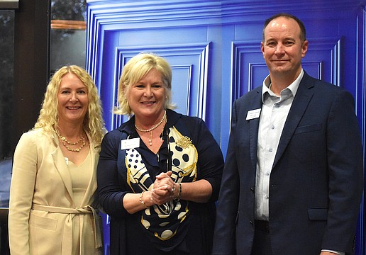 Lakewood Ranch Community Foundation Executive Director Kate Mulligan, Meals on Wheels Plus President and CEO Maribeth Phillips, and Lakewood Ranch Community Foundation President Jeffrey Toale gather together after Phillips accepted a $25,000 grant to beautify Daybreak.