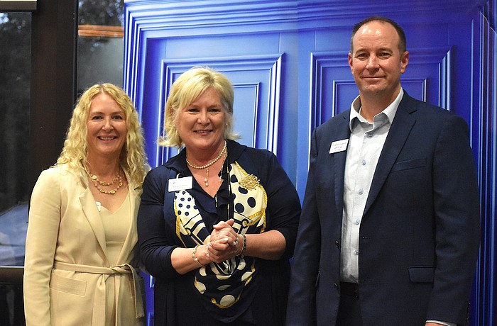 Lakewood Ranch Community Foundation Executive Director Kate Mulligan, Meals on Wheels Plus President and CEO Maribeth Phillips, and Lakewood Ranch Community Foundation President Jeffrey Toale gather together after Phillips accepted a $25,000 grant to beautify Daybreak.