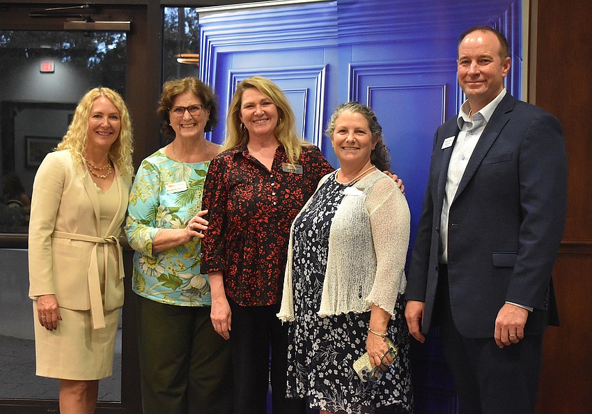 Community Foundation Executive Director Kate Mulligan, Neuro Challenge Foundation for Parkinson's representatives Margaret Ann Behrends, Jennifer Bitner and April Mochini, and Community Foundation President Jeffrey Toale celebrate another grant.